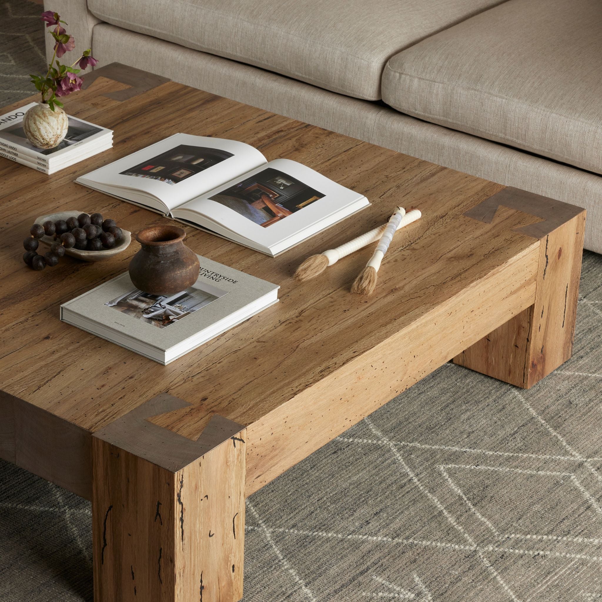 Simply Elevated - Elevate your living space with our Abaso Coffee Table. A captivating piece constructed from thick oak veneer, and chunky squared legs beautifully mimics the charm of wormwood, adding character and warmth to any room. 