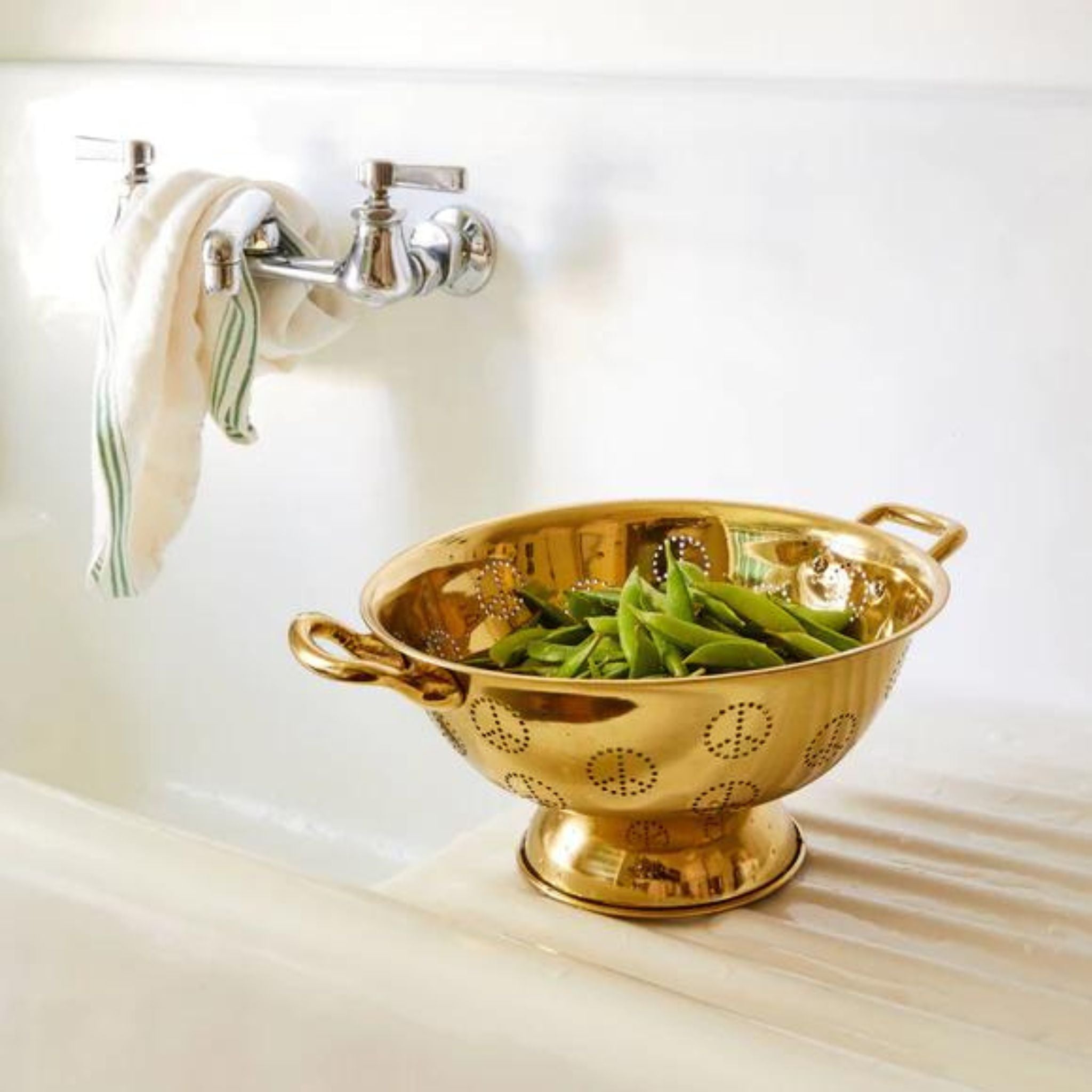 Simply Elevated - The Brass Peace Colander may be the most adorable sieve we've ever seen. Made from shiny solid brass and featuring little peace signs comprised of holes for liquids to seep through, the colander is sure to delight cooks and guests alike.