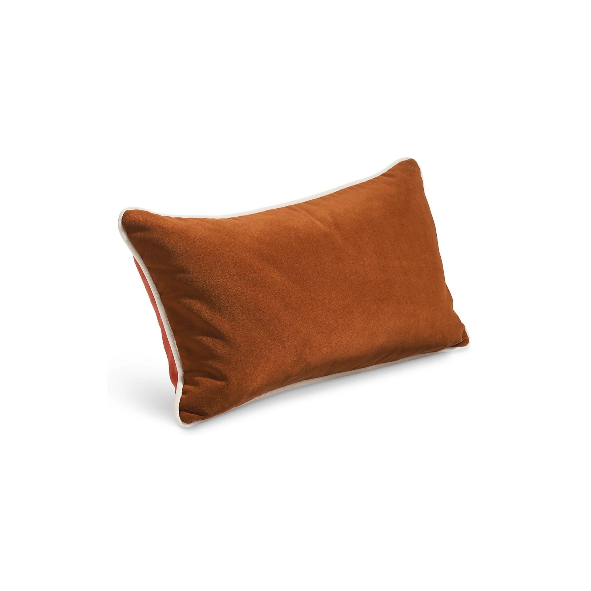 Our Jinx pillow brings the timeless appeal of velvet outdoors. Featuring a two-tone design with a piping border detail, each of these modern outdoor throw pillows is available in timeless colors for easy styling.