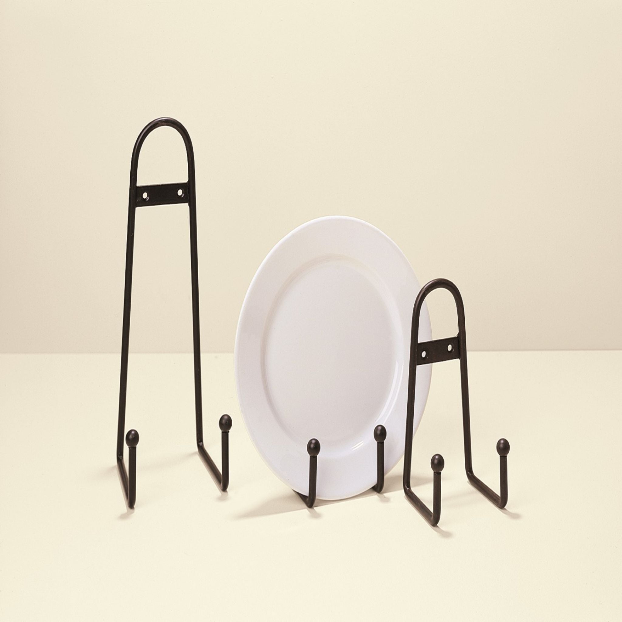 Simply Elevated - Enhance your tabletop presentation with our meticulously crafted hand-formed iron plate stand. 