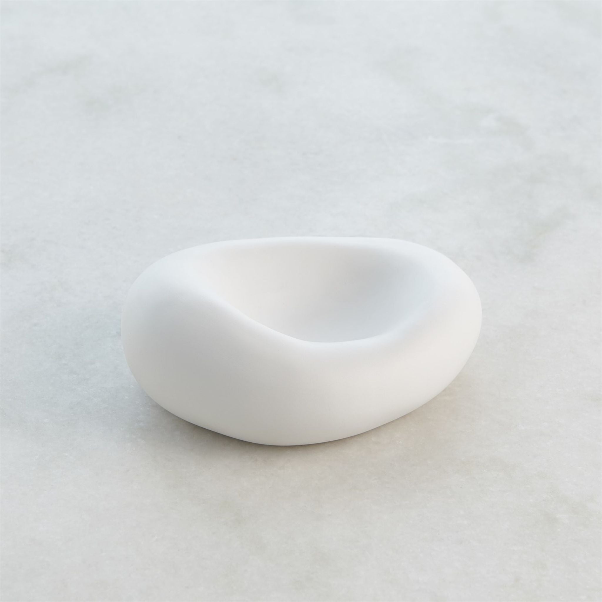 SIMPLY ELEVATED - Crafted in Italy, these organic shaped ceramic bowls have a matte white finish and available in two sizes.