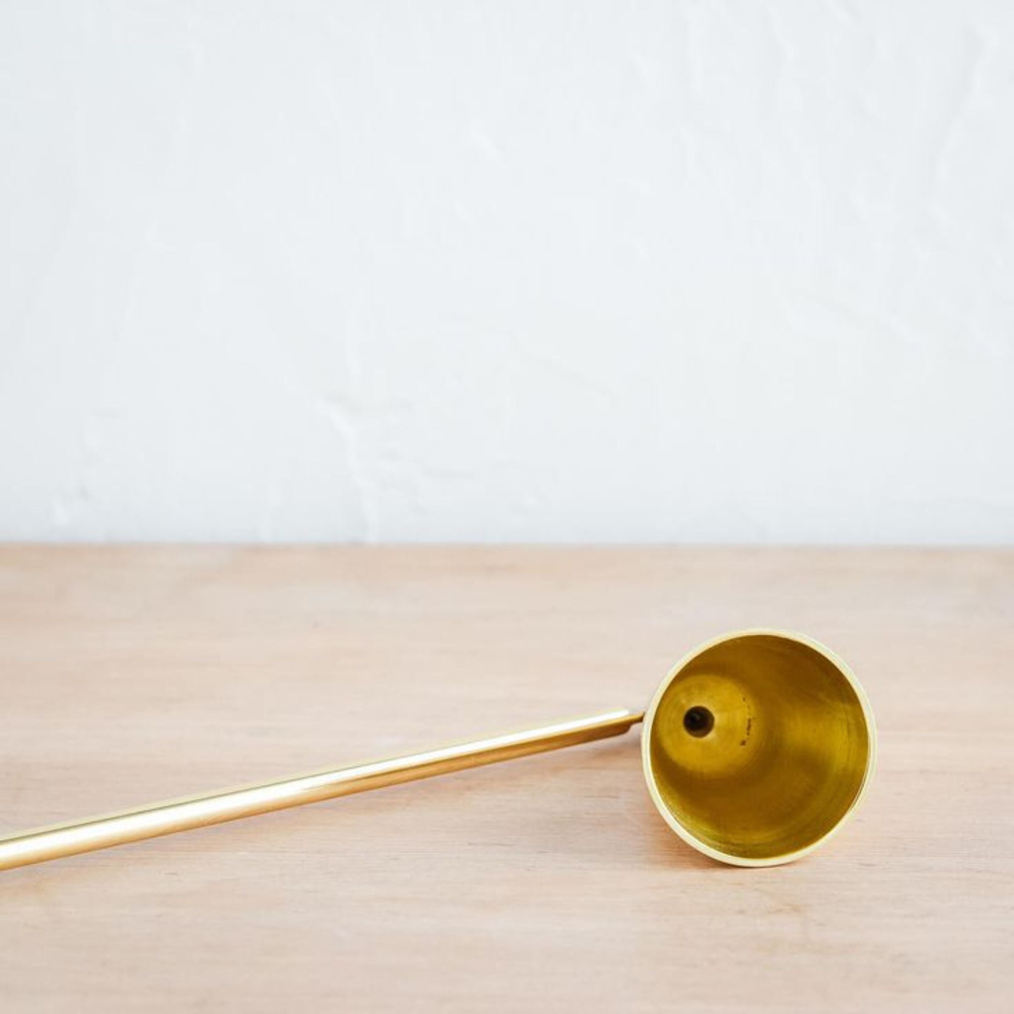 SIMPLY ELEVATED - Our Modernist Candle Douter is an elemental tool, designed to extinguish a flame without risk of spattered wax. As clean in line as it is in purpose, the solid brass construction in hinged at the cone for easy use from any height or angle. Save your breath, and let the douter do.