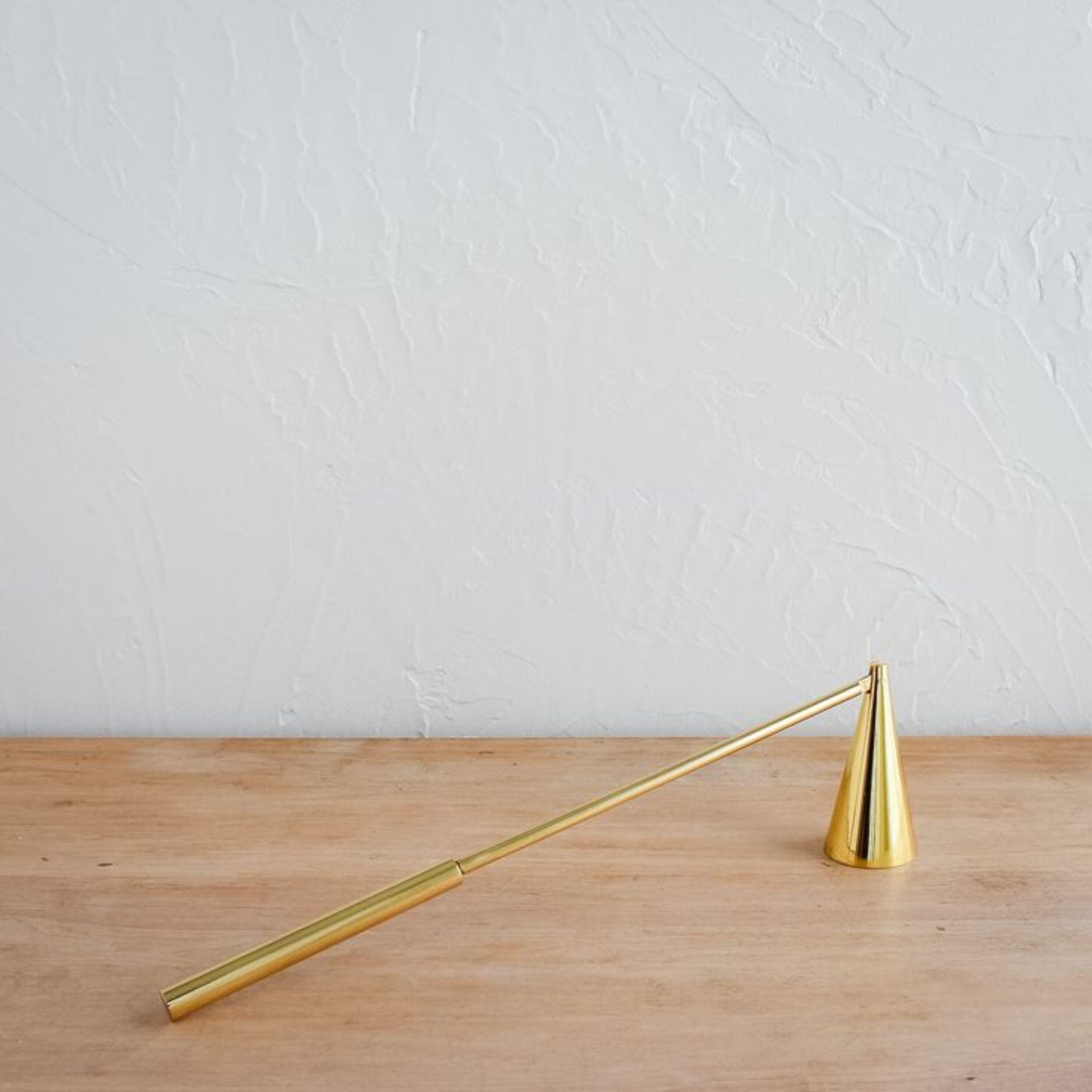 Our Modernist Candle Douter is an elemental tool, designed to extinguish a flame without risk of spattered wax. As clean in line as it is in purpose, the solid brass construction in hinged at the cone for easy use from any height or angle. Save your breath, and let the douter do. SIMPLY ELEVATED 