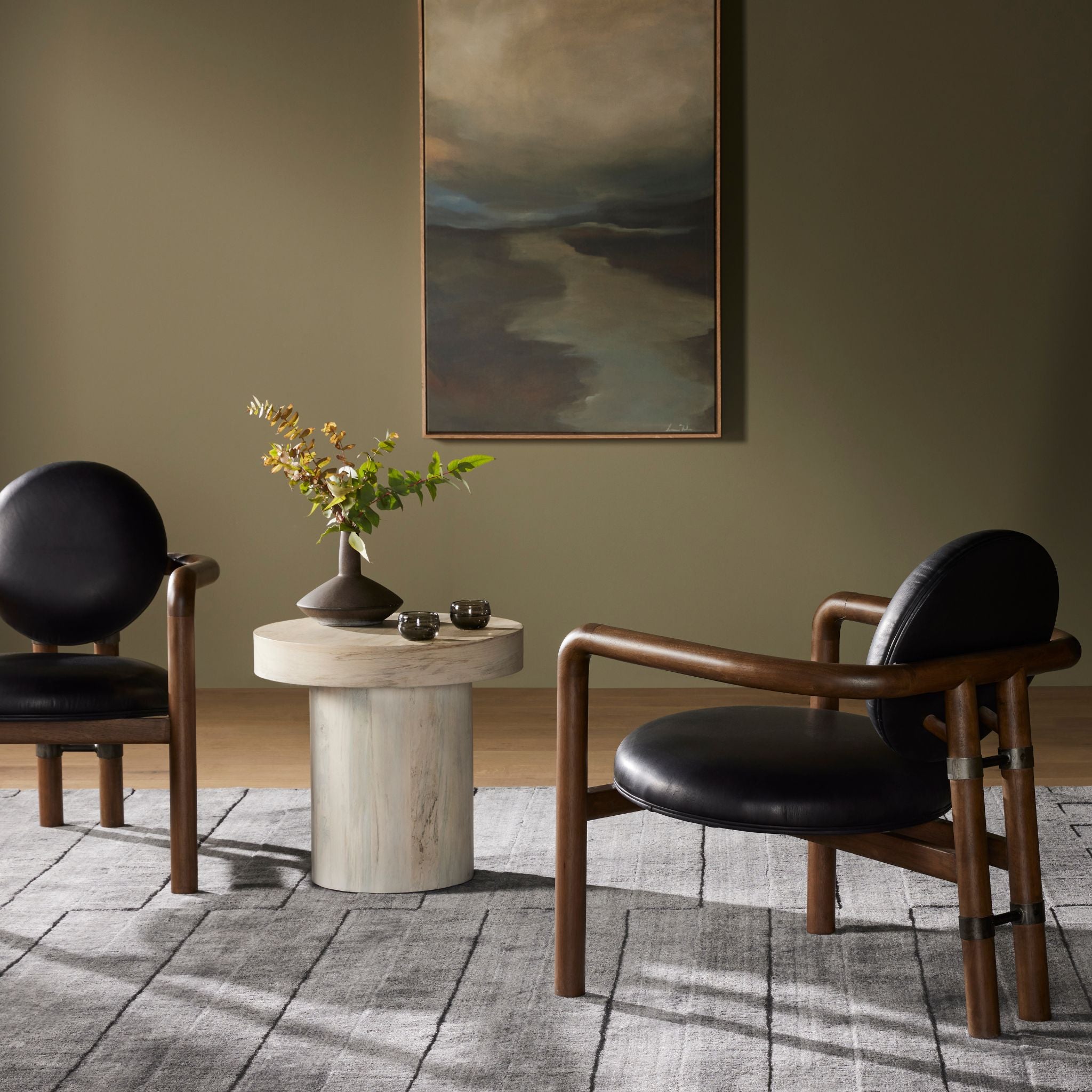 SIMPLY ELEVATED - Elevated your living space with our playful and captivating Bria Chair, a modern interpretation of Italian design. Crafted from solid parawood, this chair showcases a slim, curved frame and a rear mock-tripod, adding a touch of whimsy to its overall aesthetic. 