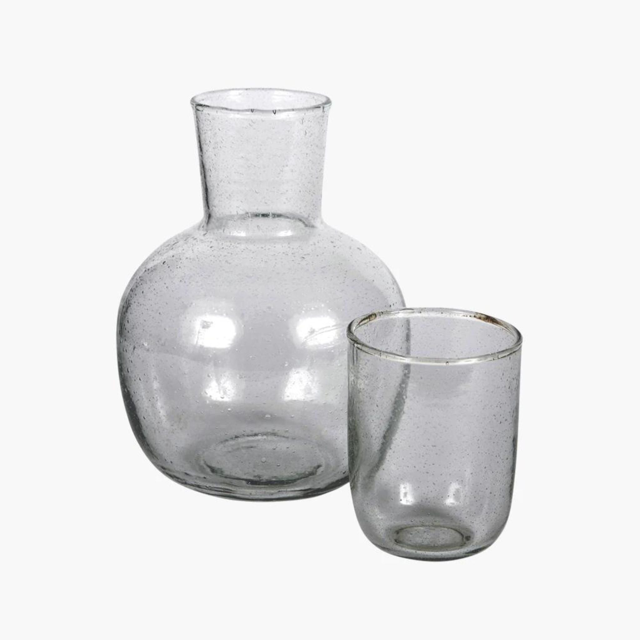 Simply Elevated - Striking Handblown carafe and drinking glass.  Reminiscent of the glass made in Biot.  Perfect on a summer table or on a nightstand.