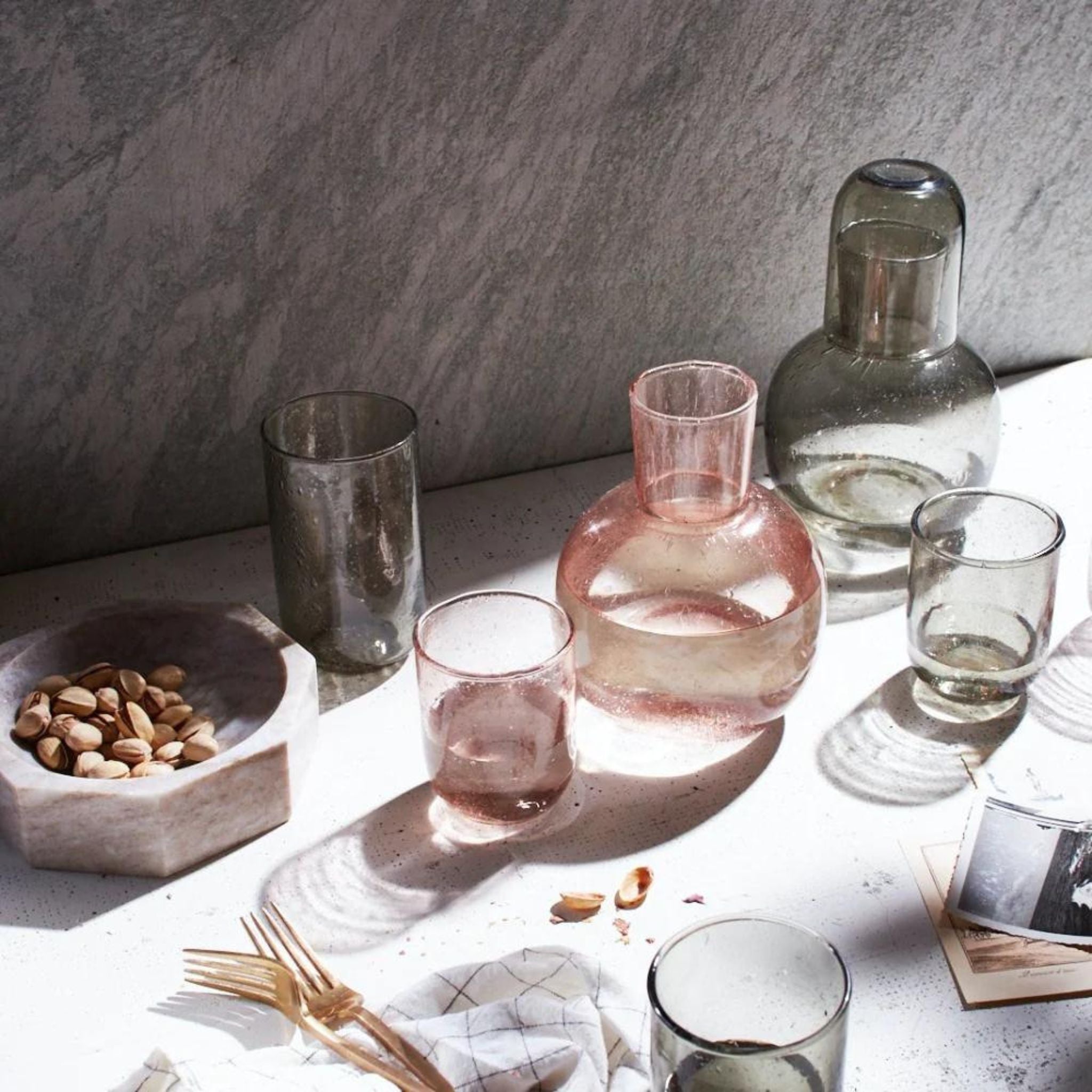 Simply Elevated - Striking Handblown carafe and drinking glass.  Reminiscent of the glass made in Biot.  Perfect on a summer table or on a nightstand.