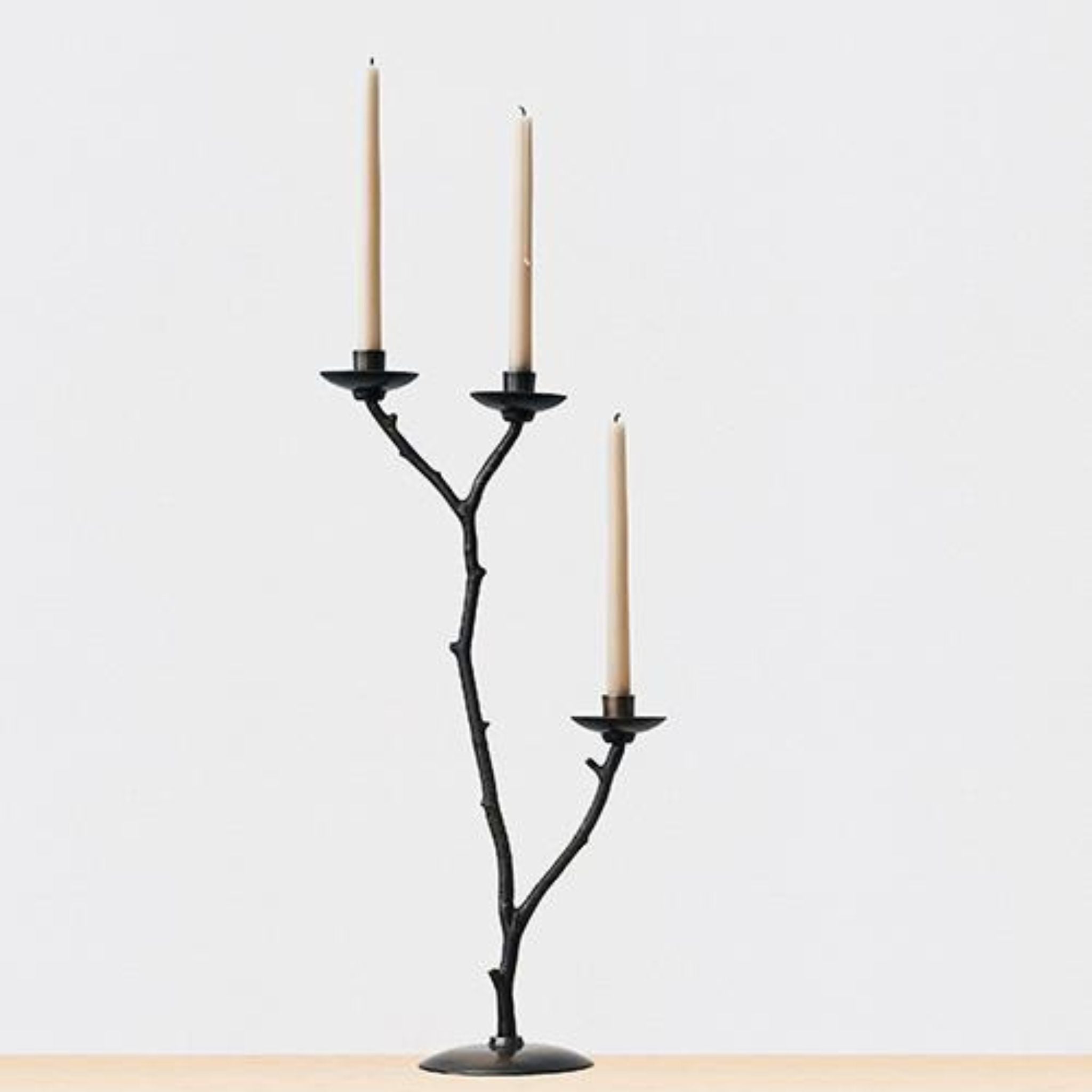 SIMPLY ELEVATED - Returning always to the natural world, candlesticks have stems based on found branches and twigs. All are distinctive shapes, purposefully selected for their individual beauty, and, for their interest together as a sculptural set.