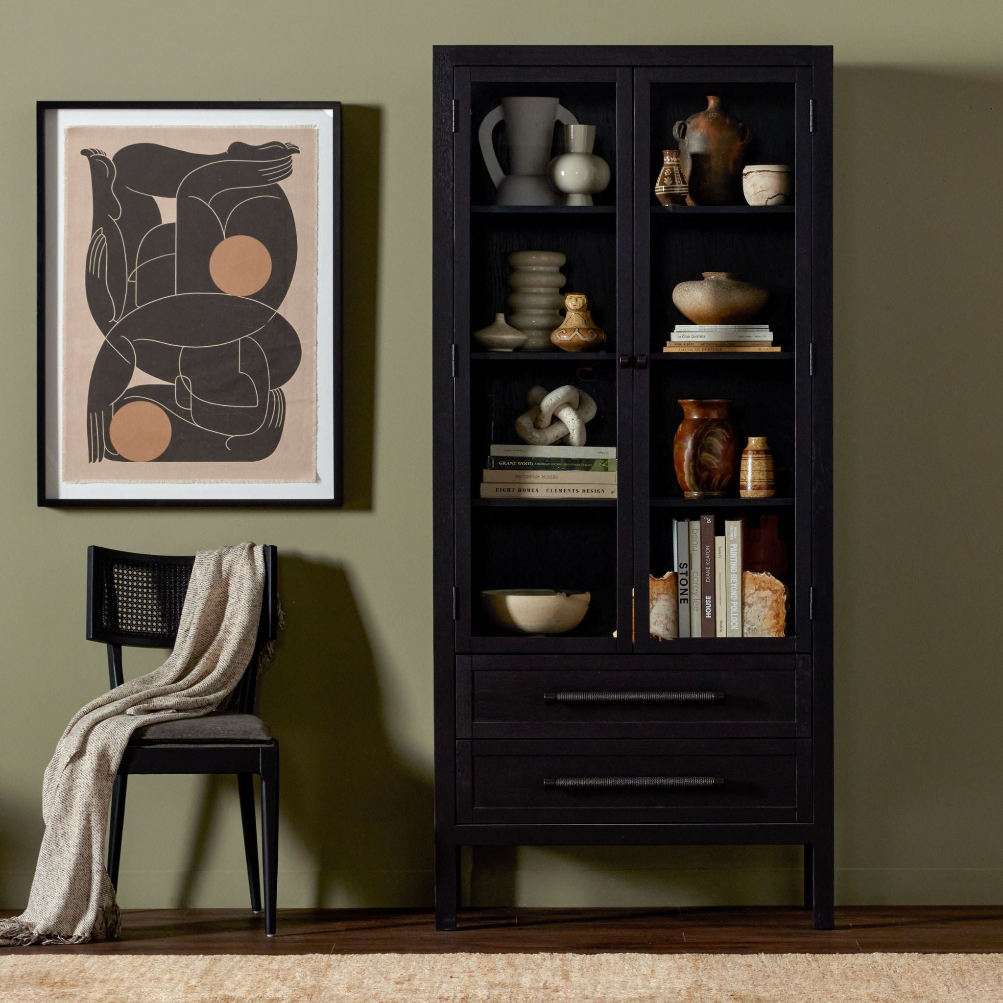 Simply Elevated - Our Laker Cabinet is crafted with attention to detail, this cabinet features glass-front doors, ample storage and display space, and thoughtful touches that enhance its visual appeal.