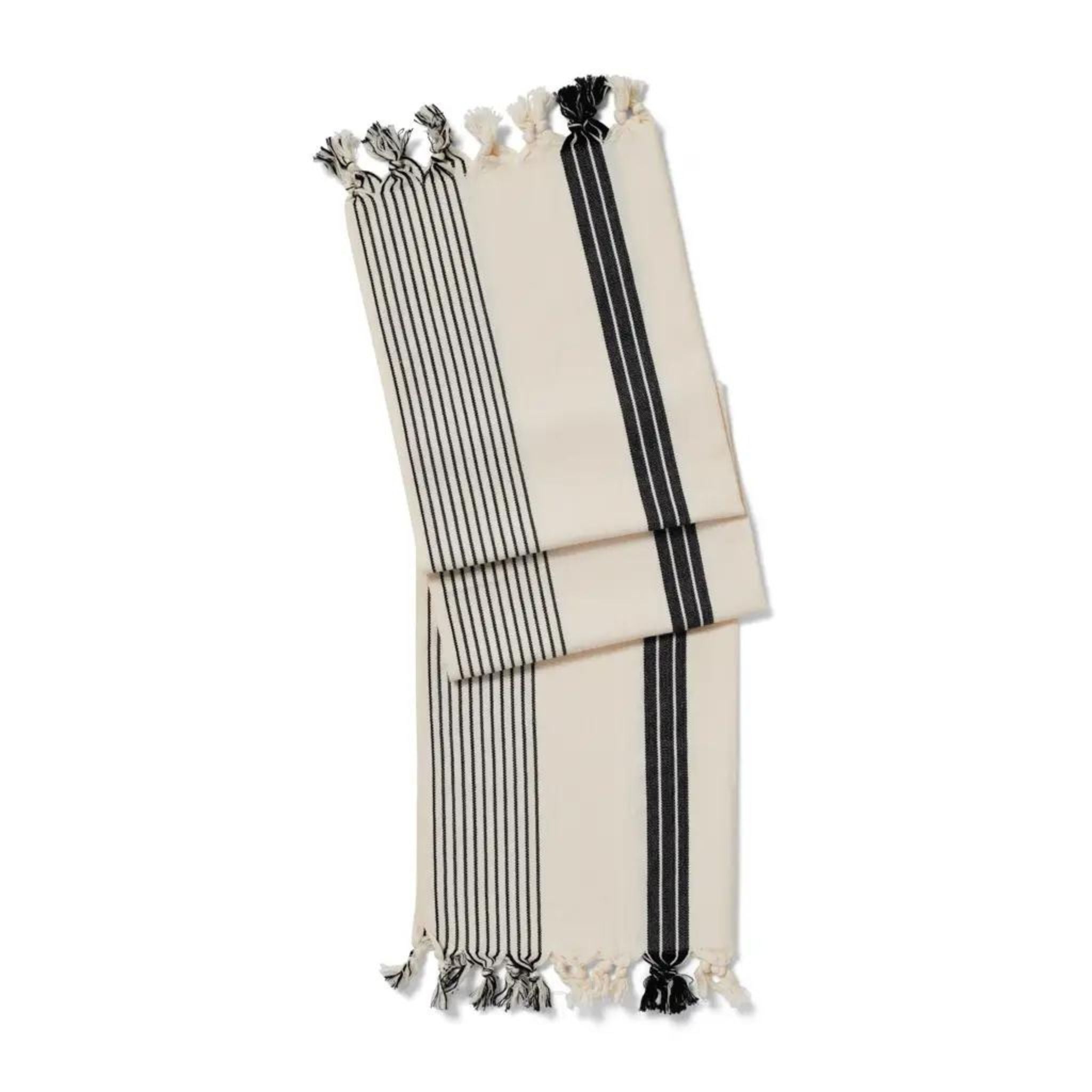 This lovely flat weave cotton towel is a super all-rounder in the home. Generously loomed with simple utility navy stripe details and a hand-finished fringe, the silas can be used as a hand, hair and tea towel, bath mat or even as a place setting at the table. Its packaging denotes multi-functional uses - perfect for those who like to do more with less.. 